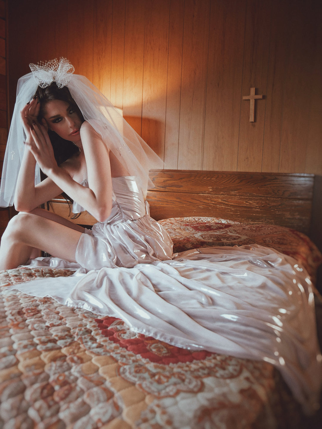 Bride wearing Wuthering Hearts blush metallic wedding dress and veil with corset bodice and flowing skirt
