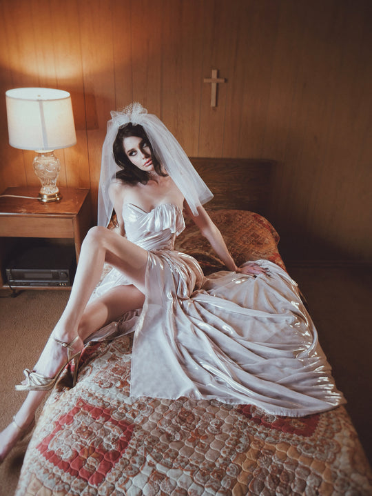 Wuthering Hearts alternative metallic wedding dress styled with bridal veil and dramatic full chiffon skirt