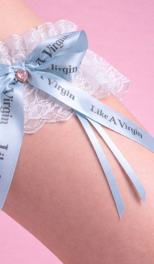 Like A Virgin baby blue satin bow bridal garter with printed ribbon and crystal heart charm on lace band