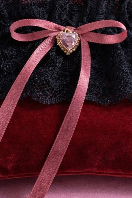 Modern wedding garter with blush printed satin bows and black lace stretch band