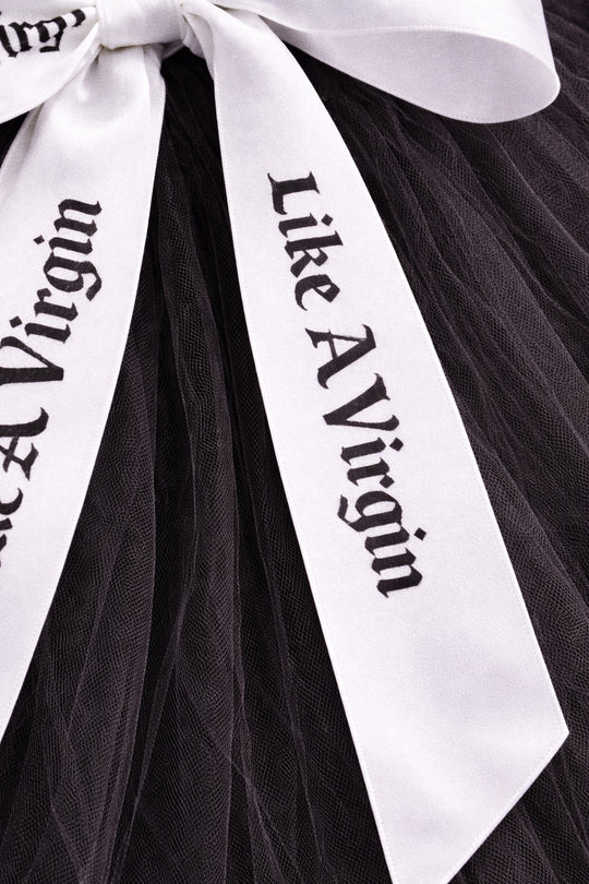 Alternative satin bow wedding veil with white printed ribbons over black tulle for modern bridal styling