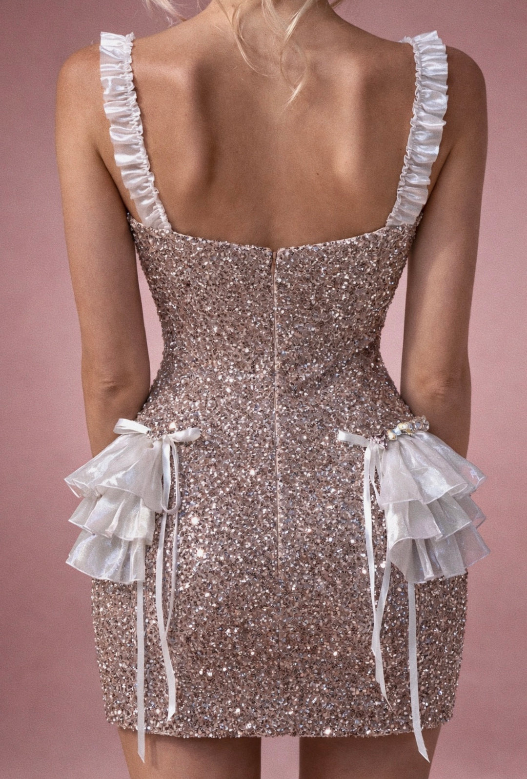 Back view of glitter mini wedding dress with invisible zipper and ruffle hips.